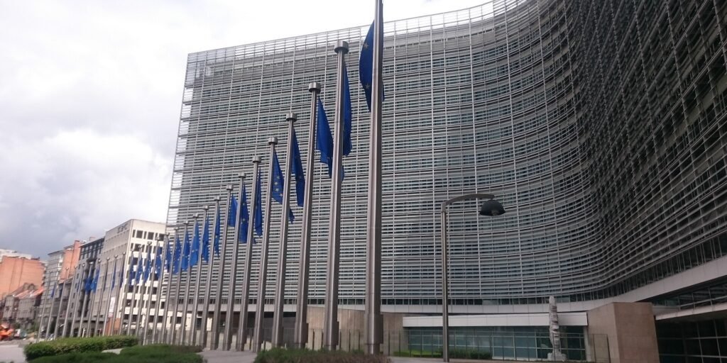 The Berlaymont building in Brussels, European Commission headquarters, with EU flags flying outside